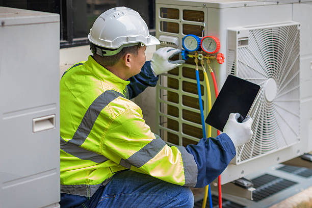 Professional Heat Pump Repair technician working in Huffman, TX
